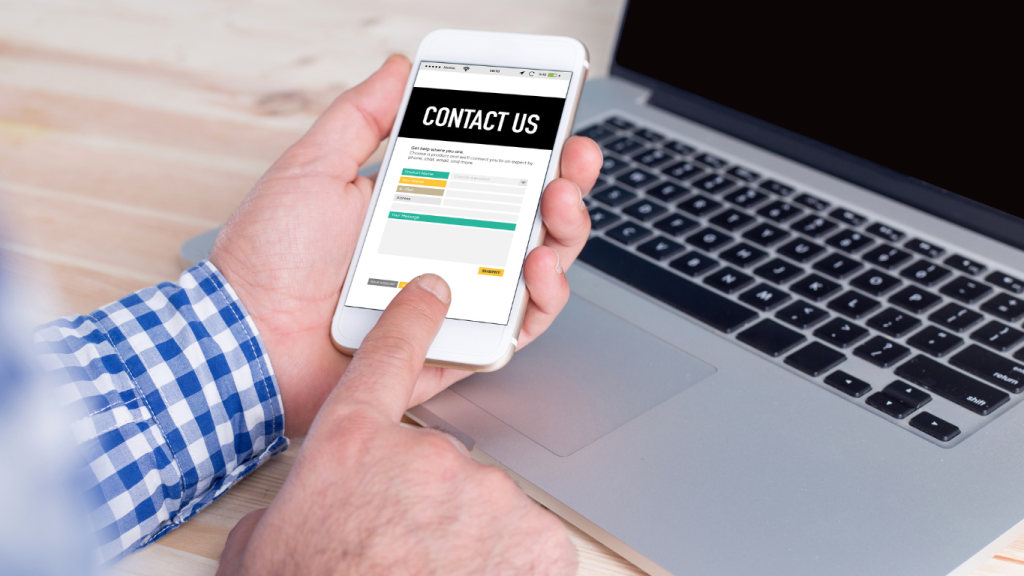 A new chiropractic patient filling out a "CONTACT US" form on a smartphone, demonstrating a successful lead conversion from an email marketing campaign.